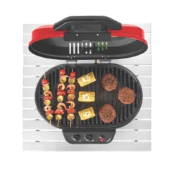 Coleman RoadTrip® 225 Portable Tabletop Propane Grill -Northcamp Supply Store 2000033047 coleman grills 225 TT heritage red flames turned on food on grates overhead 3